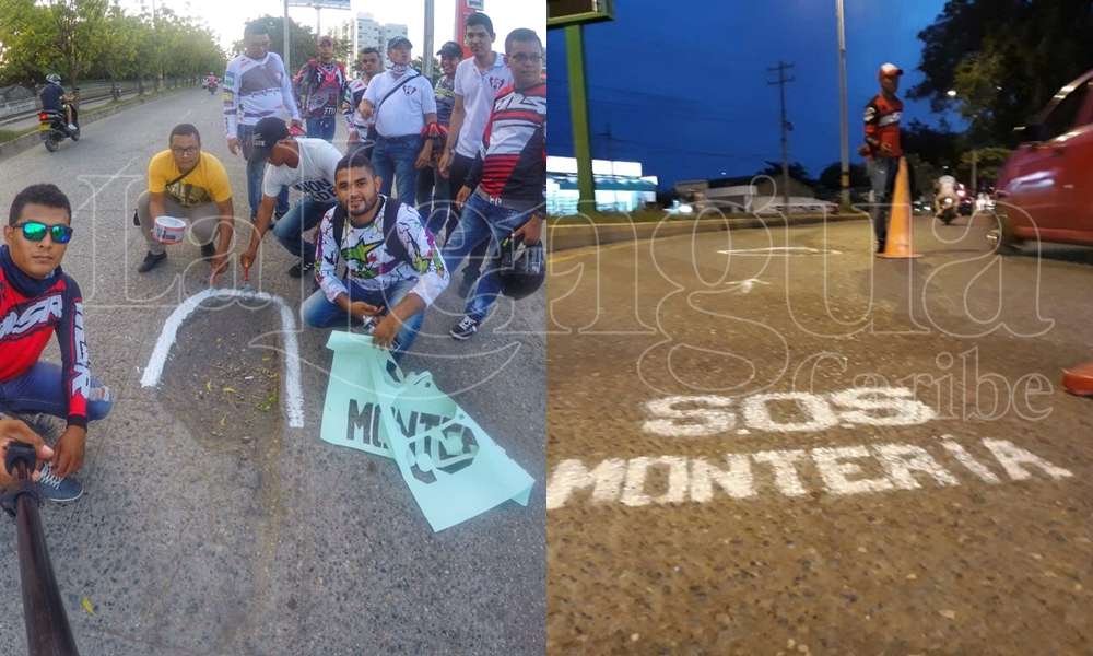 Motociclistas monterianos pintan huecos en la calles de la ciudad para evitar accidentes