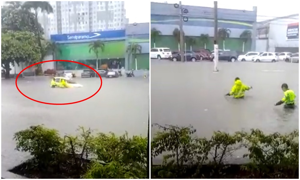Rescatan a personas que se quedaron atrapadas en un taxi en una inundación en Barranquilla